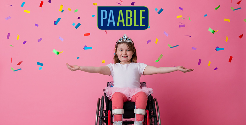 child in wheelchair with confetti